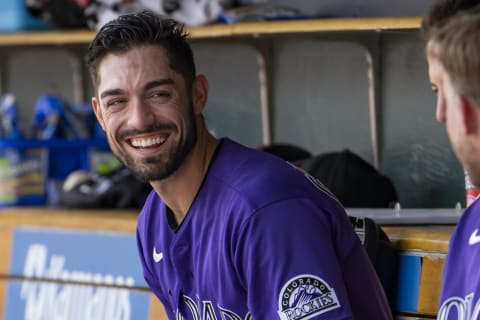 Apr 24, 2022; Detroit, Michigan, USA; Colorado Rockies center fielder Randal Grichuk (15) shares a laugh with teammates in the dugout during the sixth inning against the Detroit Tigers at Comerica Park. Mandatory Credit: Raj Mehta-USA TODAY Sports