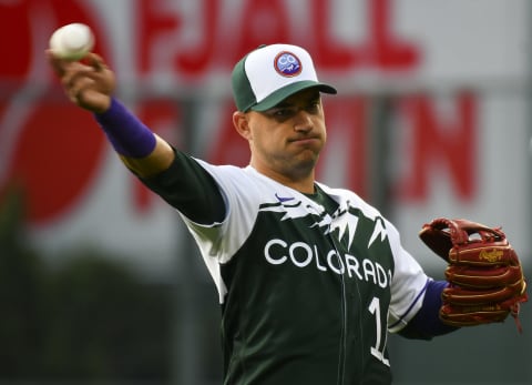 Jun 4, 2022; Denver, Colorado, USA; Colorado Rockies shortstop Jose Iglesias (11) warms up prior to a game against the Atlanta Braves wearing the teams newÒCity ConnectÓ jersey at Coors Field. Mandatory Credit: John Leyba-USA TODAY Sports