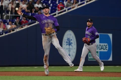 Jun 21, 2022; Miami, Florida, USA; Colorado Rockies third baseman Ryan McMahon (24) throws out Miami Marlins first baseman Garrett Cooper (not pictured) to end the 3rd inning at loanDepot park. Mandatory Credit: Jasen Vinlove-USA TODAY Sports