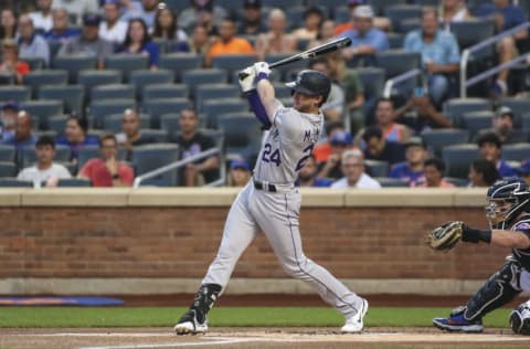 Aug 26, 2022; New York City, New York, USA; Colorado Rockies third baseman Ryan McMahon (24) hits a single in the first inning against the New York Mets at Citi Field. Mandatory Credit: Wendell Cruz-USA TODAY Sports