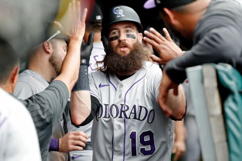 Sep 17, 2022; Chicago, Illinois, USA; Colorado Rockies designated hitter Charlie Blackmon (19) is congratulated in the dugout after scoring a run against the Chicago Cubs during the ninth inning at Wrigley Field. Mandatory Credit: Jon Durr-USA TODAY Sports