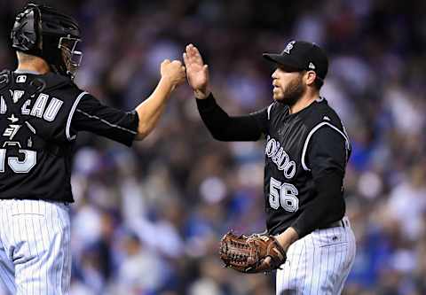 Apr 8, 2017; Denver, CO, USA; Colorado Rockies reliever Greg Holland (56) and catcher Dustin Garneau (13) celebrate a win over the Los Angeles Dodgers at Coors Field. The Rockies defeated the Dodgers 4-2. The Mandatory Credit: Ron Chenoy-USA TODAY Sports