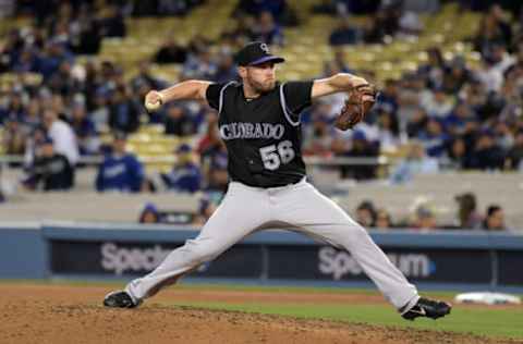 Apr 18, 2017; Los Angeles, CA, USA; Colorado Rockies pitcher Greg Holland (56) delivers a pitch in the ninth inning against the Los Angeles Dodgers during a MLB baseball game at Dodger Stadium. The Rockies defeated the Dodgers 4-3. Mandatory Credit: Kirby Lee-USA TODAY Sports