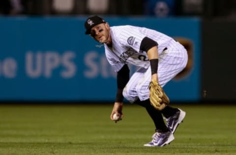 Apr 25, 2017; Denver, CO, USA; Colorado Rockies shortstop Trevor Story (27) fields the ball in the first inning against the Washington Nationals at Coors Field. Mandatory Credit: Isaiah J. Downing-USA TODAY Sports