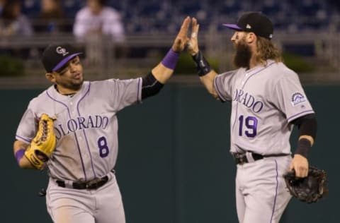 May 23, 2017; Philadelphia, PA, USA; Colorado Rockies center fielder Charlie Blackmon (19) and left fielder Gerardo Parra (8) celebrate a victory against the Philadelphia Phillies at Citizens Bank Park. Mandatory Credit: Bill Streicher-USA TODAY Sports