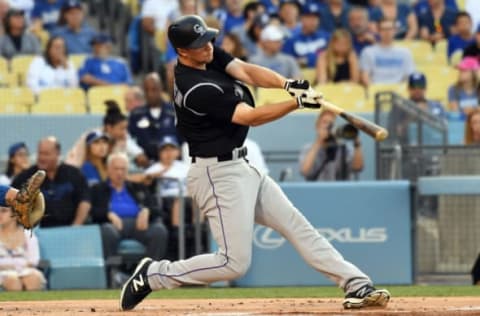 Jun 24, 2017; Los Angeles, CA, USA; Colorado Rockies second baseman DJ LeMahieu (9) hits a double against the Los Angeles Dodgers in the first inning at Dodger Stadium. Mandatory Credit: Richard Mackson-USA TODAY Sports