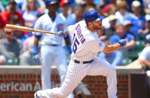 Jul 7, 2015; Chicago, IL, USA; Chicago Cubs right fielder Chris Denorfia (15) hits a two run RBI single during the third inning against the St. Louis Cardinals in game one of a baseball doubleheader at Wrigley Field. Mandatory Credit: Caylor Arnold-USA TODAY Sports