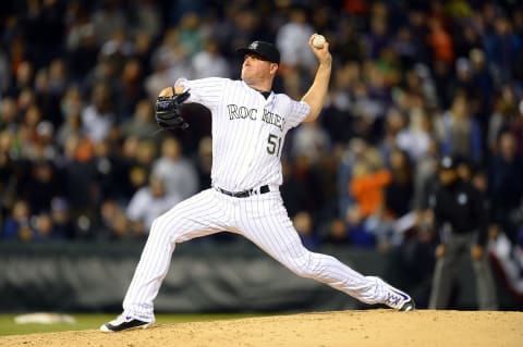 May 27, 2016; Denver, CO, USA; Colorado Rockies relief pitcher Jake McGee (51) delivers a pitch in the ninth inning against the San Francisco Giants at Coors Field. The Rockies defeated the Giants 5-2. Mandatory Credit: Ron Chenoy-USA TODAY Sports