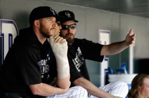 Aug 7, 2016; Denver, CO, USA; Colorado Rockies shortstop Trevor Story (27) looks on looks on from the dugout in the first inning against the Miami Marlins at Coors Field. Mandatory Credit: Isaiah J. Downing-USA TODAY Sports