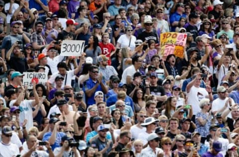 Aug 7, 2016; Denver, CO, USA; Fans hold up signs for center fielder Ichiro Suzuki (not pictured) after his 3000 major league hit in the seventh inning of the game against the Colorado Rockies at Coors Field. Mandatory Credit: Isaiah J. Downing-USA TODAY Sports