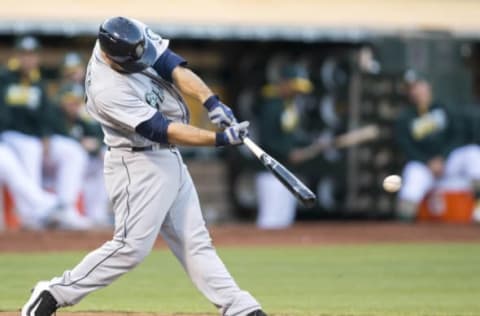 Aug 13, 2016; Oakland, CA, USA; Seattle Mariners catcher Chris Iannetta (33) singles on a sharp line drive to Oakland Athletics left fielder Khris Davis (not pictured) during the fifth inning at the Coliseum. Mandatory Credit: Neville E. Guard-USA TODAY Sports