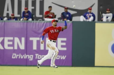 Sep 30, 2016; Arlington, TX, USA; Texas Rangers center fielder Ian Desmond (20) makes a catch in the second inning against the Tampa Bay Rays at Globe Life Park in Arlington. Mandatory Credit: Tim Heitman-USA TODAY Sports