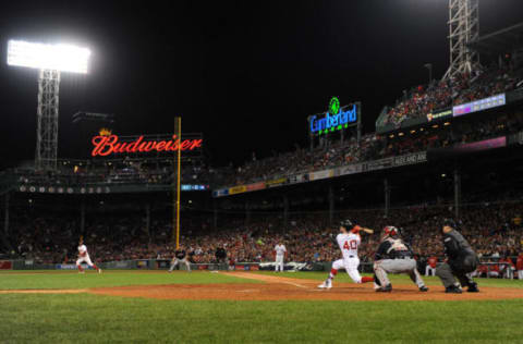 Oct 10, 2016; Boston, MA, USA; Boston Red Sox left fielder Andrew Benintendi (40) connects for a RBI double in the fifth inning against the Cleveland Indians during game three of the 2016 ALDS playoff baseball series at Fenway Park. Mandatory Credit: Bob DeChiara-USA TODAY Sports