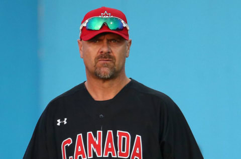 Jul 16, 2015; Toronto, Ontario, CAN; Canada first base coach Larry Walker (33) looks on against Puerto Rico during the 2015 Pan Am Games at Ajax Pan Am Ballpark. Mandatory Credit: Tom Szczerbowski-USA TODAY Sports