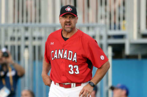 Jul 18, 2015; Toronto, Ontario, CAN; Canada first base coach Larry Walker (33) yells at the baserunner against Puerto Rico during the 2015 Pan Am Games at Ajax Pan Am Ballpark. Canada beat Puerto Rico 7-1 Mandatory Credit: Tom Szczerbowski-USA TODAY Sports