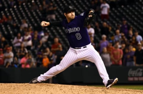 Aug 31, 2016; Denver, CO, USA; Colorado Rockies relief pitcher Adam Ottavino (0) delivers a pitch in the ninth inning against the Los Angeles Dodgers at Coors Field. The Dodgers defeated the Rockies 10-8. Mandatory Credit: Ron Chenoy-USA TODAY Sports