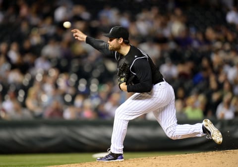 Jul 7, 2016; Denver, CO, USA; Colorado Rockies relief pitcher Adam Ottavino (0) delivers a pitch in ninth inning against the Philadelphia Phillies at Coors Field. The Rockies defeated the Phillies 11-2. Mandatory Credit: Ron Chenoy-USA TODAY Sports