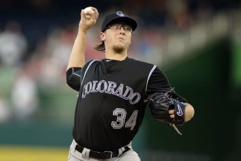 Jul 7, 2016; Denver, CO, USA; Colorado Rockies relief pitcher Adam Ottavino (0) delivers a pitch in ninth inning against the Philadelphia Phillies at Coors Field. The Rockies defeated the Phillies 11-2. Mandatory Credit: Ron Chenoy-USA TODAY Sports