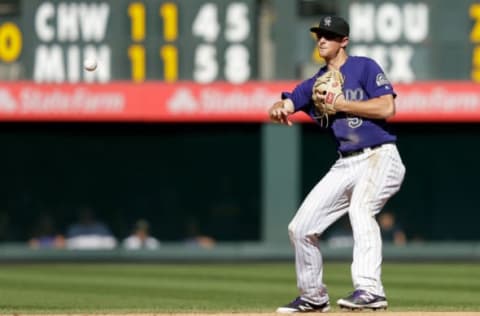 Sep 4, 2016; Denver, CO, USA; Colorado Rockies second baseman DJ LeMahieu (9) makes a throw to second for an out in the sixth inning against the Arizona Diamondbacks at Coors Field. Mandatory Credit: Isaiah J. Downing-USA TODAY Sports