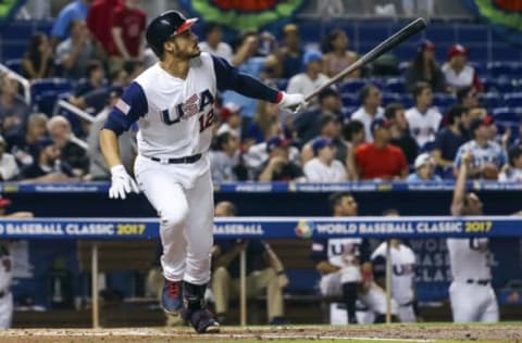 Mar 12, 2017; Miami, FL, USA; USA infielder Nolan Arenado (12) hits a home run in the second inning against Canada during the 2017 World Baseball Classic at Marlins Park . Mandatory Credit: Logan Bowles-USA TODAY Sports