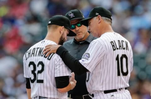 May 7, 2017; Denver, CO, USA; Colorado Rockies head athletic trainer Keith Dugger and manager Bud Black (10) meet with starting pitcher Tyler Chatwood (32) in the eighth inning against the Arizona Diamondbacks at Coors Field. Mandatory Credit: Isaiah J. Downing-USA TODAY Sports