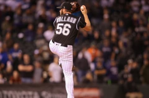 May 11, 2017; Denver, CO, USA; Colorado Rockies pitcher Greg Holland (56) delivers a pitch during the ninth inning against the Los Angeles Dodgers at Coors Field. Mandatory Credit: Chris Humphreys-USA TODAY Sports