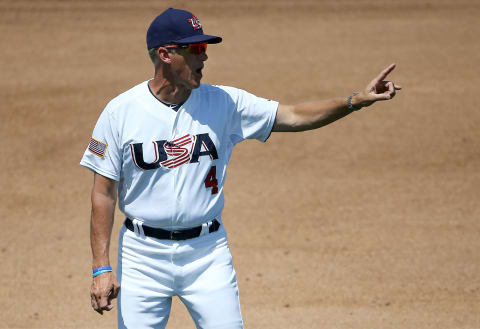 Jul 16, 2015; Toronto, Ontario, CAN; United States manager Jim Tracy (4) comes out to argue a call at second base in the fourth inning against the Dominican Republic during the 2015 Pan Am Games at Ajax Pan Am Ballpark. Mandatory Credit: Tom Szczerbowski-USA TODAY Sports