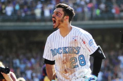 Jun 18, 2017; Denver, CO, USA; Colorado Rockies third baseman Nolan Arenado (28) celebrates after hitting a walk off three run home run to complete the cycle during the ninth inning against the San Francisco Giants at Coors Field. Mandatory Credit: Chris Humphreys-USA TODAY Sports