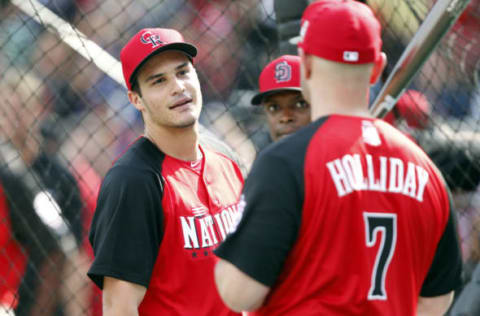 Jul 13, 2015; Cincinnati, OH, USA; National League third baseman Nolan Arenado (right) of the Colorado Rockies talks with National League outfielder Matt Holliday (7) of the St. Louis Cardinals as National League outfielder Justin Upton (center) of the Sand Diego Padres looks on during workout day the day before the 2015 MLB All Star Game at Great American Ballpark. Mandatory Credit: Frank Victores-USA TODAY Sports