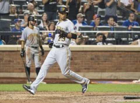 Aug 15, 2015; New York City, NY, USA; Pittsburgh Pirates shortstop Pedro Florimon (23) scores the go ahead run on a single by Pirates catcher Chris Stewart (not pictured) during the fourteenth inning of the game against the New York Mets at Citi Field. Mandatory Credit: Gregory J. Fisher-USA TODAY Sports