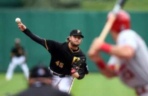 Pittsburgh Pirates starting pitcher Gerrit Cole (45) pitches against St. Louis Cardinals third baseman Matt Carpenter (R) during the fourth inning at PNC Park. Charles LeClaire-USA TODAY Sports