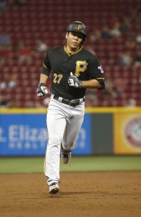 Sep 9, 2015; Cincinnati, OH, USA; Pittsburgh Pirates third baseman Jung Ho Kang rounds the bases after hitting a grand slam home run against the Cincinnati Reds in the sixth inning at Great American Ball Park. Mandatory Credit: David Kohl-USA TODAY Sports