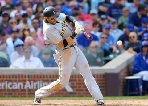 Sep 25, 2015; Chicago, IL, USA; Pittsburgh Pirates first baseman Michael Morse hits a RBI single against the Chicago Cubs during the seventh inning at Wrigley Field. Mandatory Credit: Jerry Lai-USA TODAY Sports