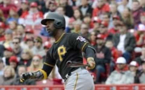 Apr 10, 2016; Cincinnati, OH, USA; Pittsburgh Pirates center fielder Andrew McCutchen hits a double against the Cincinnati Reds during the second inning at Great American Ball Park. Mandatory Credit: David Kohl-USA TODAY Sports