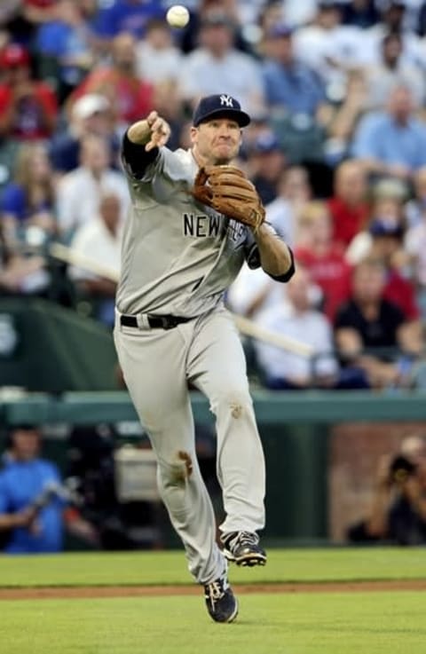 Apr 27, 2016; Arlington, TX, USA; New York Yankees third baseman Chase Headley (12) throws to first base during the game against the Texas Rangers at Globe Life Park in Arlington. Mandatory Credit: Kevin Jairaj-USA TODAY Sports