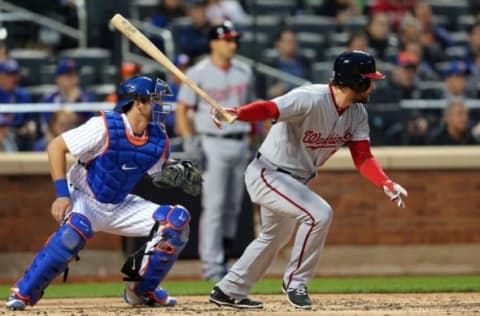 May 18, 2016; New York City, NY, USA; Washington Nationals second baseman Daniel Murphy (20) hits a RBI single against the New York Mets during the third inning at Citi Field. Mandatory Credit: Brad Penner-USA TODAY Sports