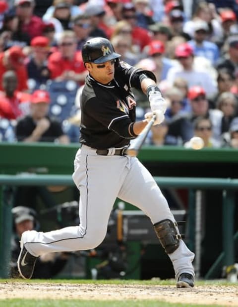 May 15, 2016; Washington, DC, USA; Miami Marlins third baseman Martin Prado (14) singles against the Washington Nationals during the seventh inning at Nationals Park. Mandatory Credit: Brad Mills-USA TODAY Sports