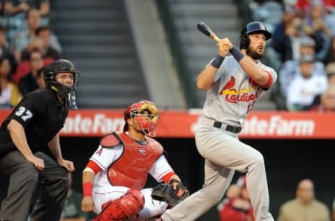 May 10, 2016; Anaheim, CA, USA; St. Louis Cardinals third baseman Matt Carpenter (13) hits a solo home run in the first inning against Los Angeles Angels at Angel Stadium of Anaheim. Mandatory Credit: Gary A. Vasquez-USA TODAY Sports