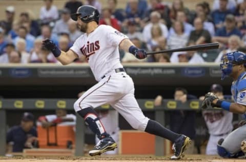 May 23, 2016; Minneapolis, MN, USA; Minnesota Twins third baseman Trevor Plouffe (24) hits a single in the first inning against the Kansas City Royals at Target Field. Mandatory Credit: Jesse Johnson-USA TODAY Sports