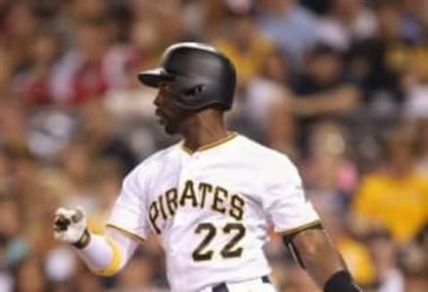 Jun 10, 2016; Pittsburgh, PA, USA; Pittsburgh Pirates center fielder Andrew McCutchen (22) doubles against the St. Louis Cardinals during the eighth inning at PNC Park. Mandatory Credit: Charles LeClaire-USA TODAY Sports