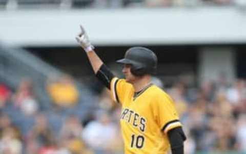 Jun 5, 2016; Pittsburgh, PA, USA; Pittsburgh Pirates shortstop Jordy Mercer (10) reacts after hitting a double against the Los Angeles Angels during the sixth inning at PNC Park. The Angels won 5-4. Mandatory Credit: Charles LeClaire-USA TODAY Sports