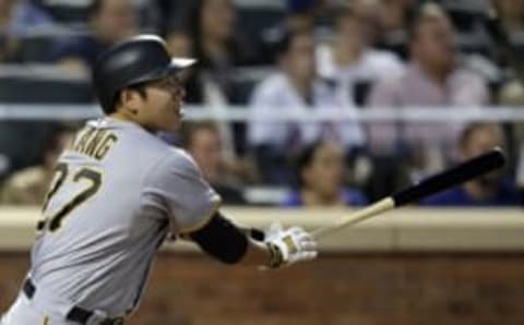 Jun 14, 2016; New York City, NY, USA; Pittsburgh Pirates third baseman Jung Ho Kang (27) hits a two-run home run against the New York Mets during the sixth inning at Citi Field. Mandatory Credit: Adam Hunger-USA TODAY Sports