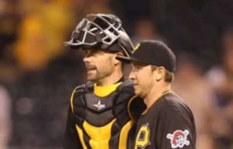 May 24, 2016; Pittsburgh, PA, USA; Pittsburgh Pirates catcher Chris Stewart (L) and relief pitcher A.J. Schugel (R) react after defeating the Arizona Diamondbacks at PNC Park. The Pirates won 12-1. Mandatory Credit: Charles LeClaire-USA TODAY Sports