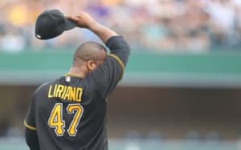 Jul 8, 2016; Pittsburgh, PA, USA; Pittsburgh Pirates starting pitcher Francisco Liriano (47) wipes his face after hitting consecutive batters against the Chicago Cubs during the second inning at PNC Park. Mandatory Credit: Charles LeClaire-USA TODAY Sports