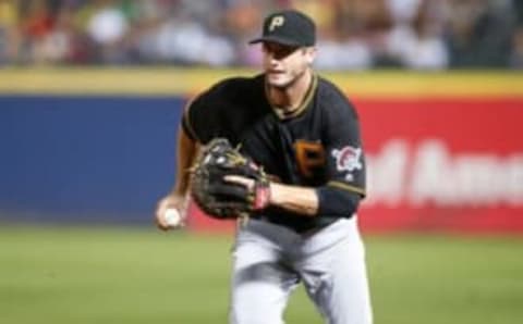 Aug 4, 2016; Atlanta, GA, USA; Pittsburgh Pirates third baseman David Freese (23) steps on first base for an out against the Atlanta Braves in the fifth inning at Turner Field. Mandatory Credit: Brett Davis-USA TODAY Sports