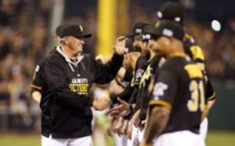 Oct 1, 2014; Pittsburgh, PA, USA; Pittsburgh Pirates manager Clint Hurdle (13) shakes hands with players during introductions prior to the 2014 National League Wild Card playoff baseball game against the San Francisco Giants at PNC Park. Mandatory Credit: Charles LeClaire-USA TODAY Sports