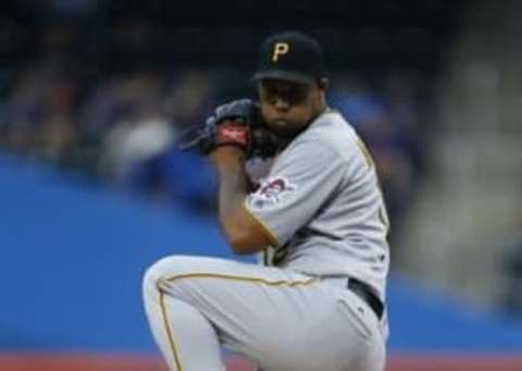 Jun 16, 2016; New York City, NY, USA; Pittsburgh Pirates starting pitcher Juan Nicasio (12) delivers a pitch against the New York Mets in the first inning at Citi Field. Mandatory Credit: Noah K. Murray-USA TODAY Sports