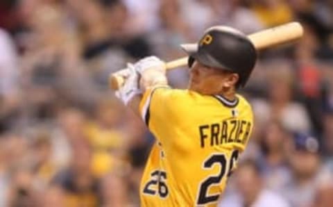 Jun 24, 2016; Pittsburgh, PA, USA; Pittsburgh Pirates right fielder Adam Frazier (26) hits an RBI single against the Los Angeles Dodgers during the second inning at PNC Park. Mandatory Credit: Charles LeClaire-USA TODAY Sports