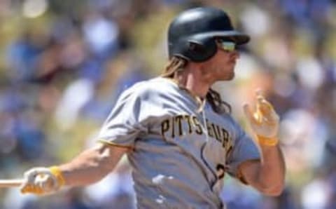 Aug 13, 2016; Los Angeles, CA, USA; Pittsburgh Pirates first baseman John Jaso (28) follows through during the fourth inning against the Los Angeles Dodgers at Dodger Stadium. Mandatory Credit: Jake Roth-USA TODAY Sports