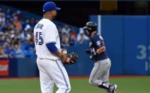 Aug 26, 2016; Toronto, Ontario, CAN; Toronto Blue Jays starting pitcher Francisco Liriano (45) watches Minnesota Twins first baseman Trevor Plouffe (24) round the bases after hitting a home run in the first inning at Rogers Centre. Mandatory Credit: Dan Hamilton-USA TODAY Sports